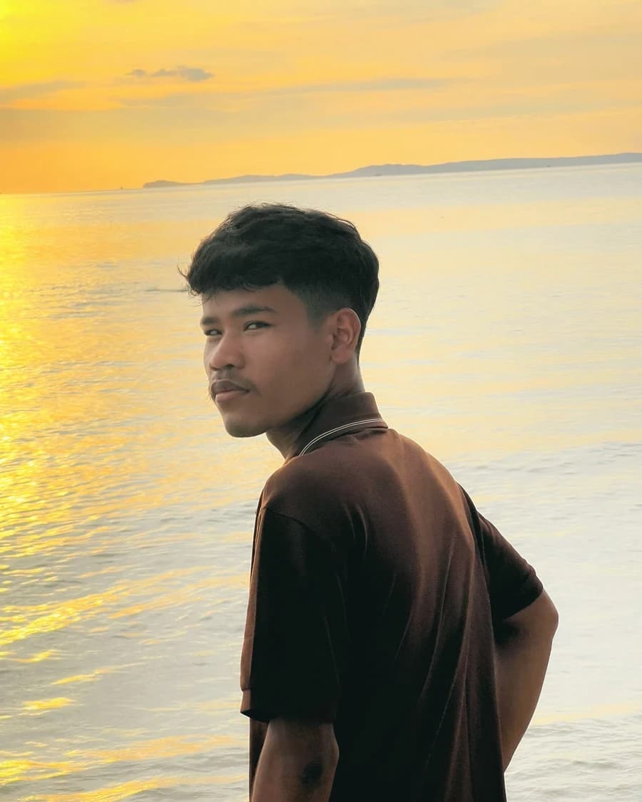 Heang Chheng Khoem by the sea at sunset